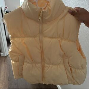 yellow puffer vest